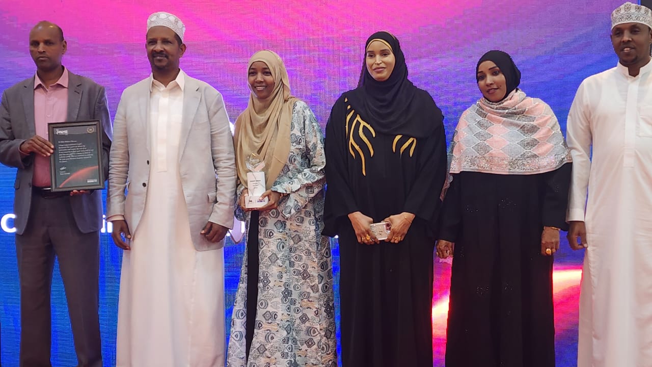 Ebla Hassan and partners at an awards recognition event